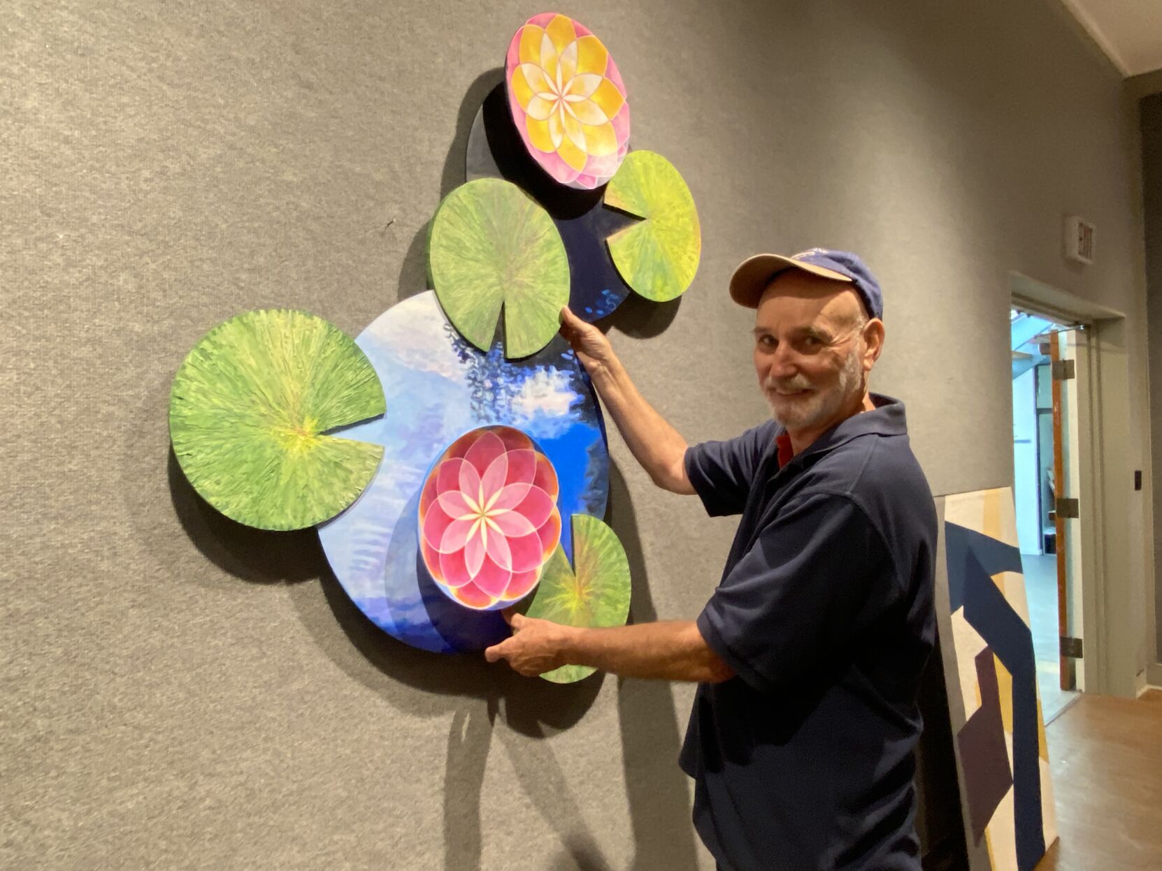 A Visual 4. Artist Gary Armstrong finding the right spot for his Art.jpeg
